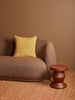 Gem Mustard 50cm Cushion styled