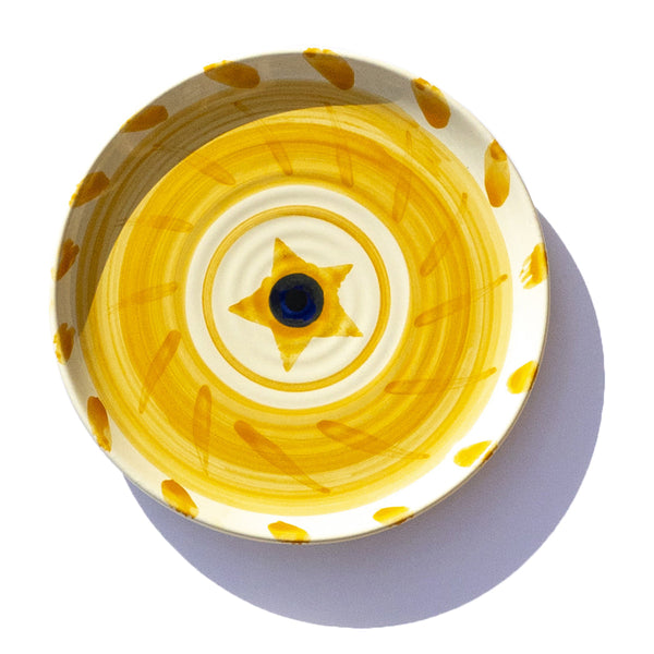 ceramic hand painted side plate yellow sun design navy centre jumbled Robert Gordon collaboration