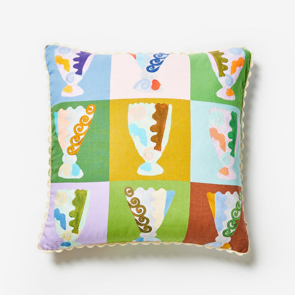 jumbled x bonnie and neil collaboration throw cushion. Hand painted vase design on linen. Features rust, lilac, green, blue, mustard and orange.