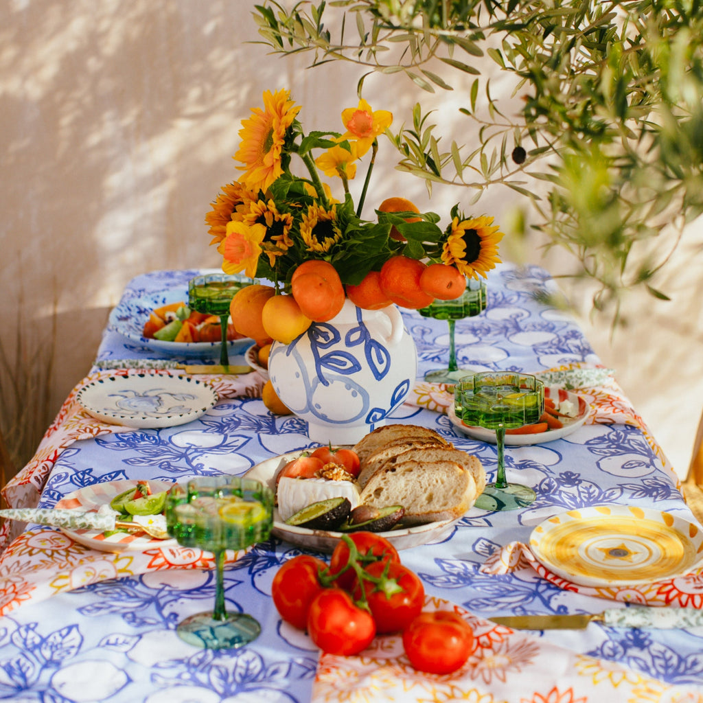 This JUMBLED x Bonnie + Neil tablecloth is perfect for any long lunch. Hand painted lemons on branches, in a classic Yves Klein blue on a soft blue background.